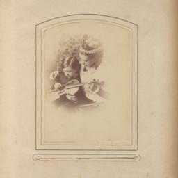 Woman and Young Boy Holding...