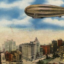 Zeppelin Flying Over City H...