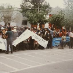 Tibetan demonstrators squat...