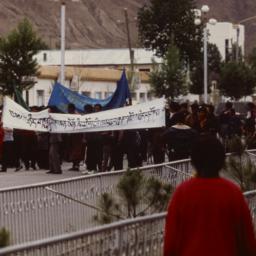 Tibetan demonstrators march...
