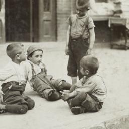 Boys Playing on Sidewalk