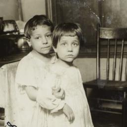 Two Children Beside a Stove