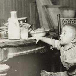 Child Reaching for Milk