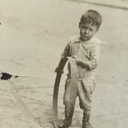 Boy with Metal Circle