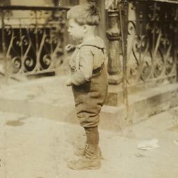 Boy Standing near Wrought I...