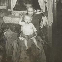 Mother Holding Child with W...